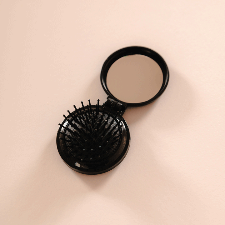 DIY Decoden customizable compact brush with mirror, adorned with charms and frosting-inspired glue, in black for easy touch-ups.