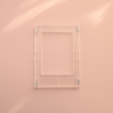 DIY Decoden customizable clear Polaroid loader frames with frosting-inspired glue, decorative sprinkles, charms, and magnets for personalizing your photos.