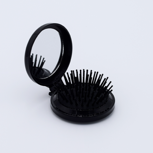 DIY Decoden customizable compact brush with mirror, adorned with charms and frosting-inspired glue, in black for easy touch-ups.