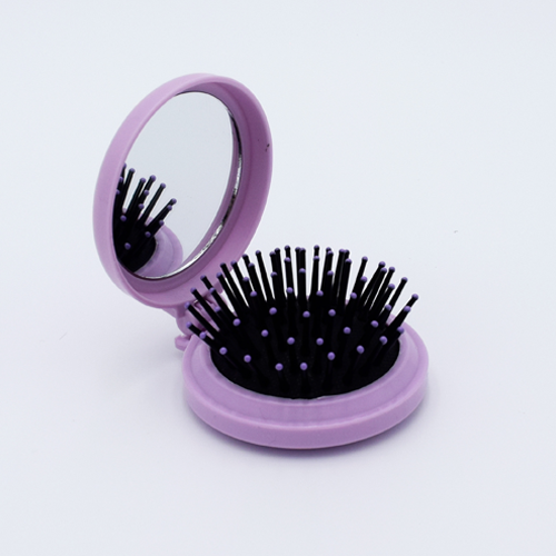 DIY Decoden customizable compact brush with mirror, adorned with charms and frosting-inspired glue, in pastel purple for easy touch-ups.