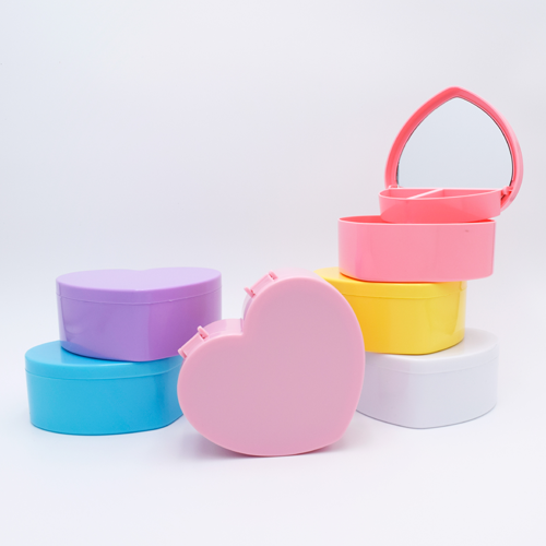 DIY Decoden customizable heart-shaped jewelry box with two-tier design and built-in mirror, ready to be decorated with frosting-inspired glues, decorative sprinkles, and charms.