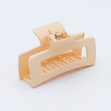 DIY Decoden customizable large hair claw in various colors, with frosting-inspired glue, decorative sprinkles, and charms, ready for decoration.