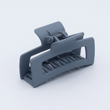 DIY Decoden customizable large hair claw in various colors, with frosting-inspired glue, decorative sprinkles, and charms, ready for decoration.