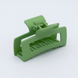 DIY Decoden customizable large hair claw in various colors, with frosting-inspired glue, decorative sprinkles, and charms, ready for decoration.