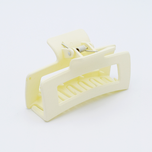 DIY Decoden customizable large hair claw in various colors, with frosting-inspired glue, decorative sprinkles, and charms, ready for decoration.