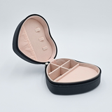 DIY Decoden customizable travel heart-shaped jewelry box in black with frosting-inspired glues, decorative sprinkles, and charms. Perfect for keeping jewelry safe and stylish on the go.