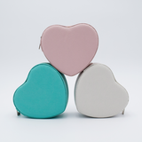 DIY Decoden customizable travel heart-shaped jewelry box with frosting-inspired glues, decorative sprinkles, and charms. Perfect for keeping jewelry safe and stylish on the go.