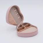 DIY Decoden customizable travel heart-shaped jewelry box in deco pink with frosting-inspired glues, decorative sprinkles, and charms. Perfect for keeping jewelry safe and stylish on the go.