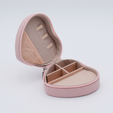 DIY Decoden customizable travel heart-shaped jewelry box in deco pink with frosting-inspired glues, decorative sprinkles, and charms. Perfect for keeping jewelry safe and stylish on the go.