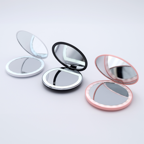 DIY Decoden customizable compact LED mirror with frosting-inspired glues, decorative sprinkles, and charms for personalization. Includes built-in LED light and charging cable.