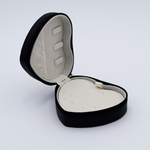 DIY Decoden customizable travel heart-shaped jewelry box in black with frosting-inspired glues, decorative sprinkles, and charms. Perfect for keeping jewelry safe and stylish on the go.