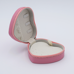 DIY Decoden customizable travel heart-shaped jewelry box in deco pink with frosting-inspired glues, decorative sprinkles, and charms. Perfect for keeping jewelry safe and stylish on the go.