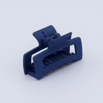 DIY Decoden customizable mini hair claw in muted blue, with frosting-inspired glue, decorative sprinkles, and charms, ready for decoration.