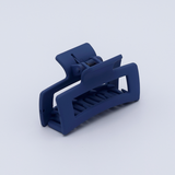 DIY Decoden customizable mini hair claw in muted blue, with frosting-inspired glue, decorative sprinkles, and charms, ready for decoration.