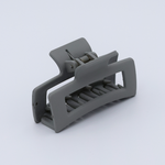 DIY Decoden customizable mini hair claw in sea salt grey, with frosting-inspired glue, decorative sprinkles, and charms, ready for decoration.