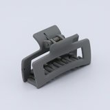 DIY Decoden customizable mini hair claw in sea salt grey, with frosting-inspired glue, decorative sprinkles, and charms, ready for decoration.