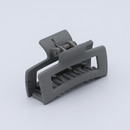 DIY Decoden customizable mini hair claw in sea salt grey, with frosting-inspired glue, decorative sprinkles, and charms, ready for decoration.