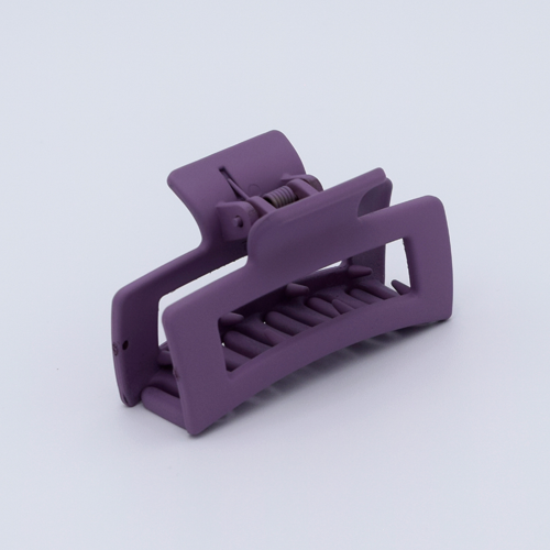 DIY Decoden customizable mini hair claw in muted purple, with frosting-inspired glue, decorative sprinkles, and charms, ready for decoration.