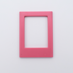 DIY Decoden customizable candy pink Polaroid loader frames with frosting-inspired glue, decorative sprinkles, charms, and magnets for personalizing your photos.