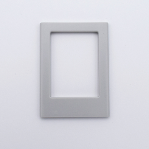 DIY Decoden customizable light gray Polaroid loader frames with frosting-inspired glue, decorative sprinkles, charms, and magnets for personalizing your photos.