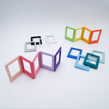 DIY Decoden customizable set of two Polaroid loader frames with frosting-inspired glue, decorative sprinkles, charms, and magnets for personalizing your photos.