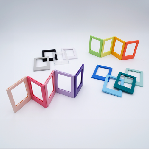 DIY Decoden customizable set of two Polaroid loader frames with frosting-inspired glue, decorative sprinkles, charms, and magnets for personalizing your photos.