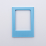 DIY Decoden customizable sky blue Polaroid loader frames with frosting-inspired glue, decorative sprinkles, charms, and magnets for personalizing your photos.