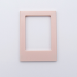 DIY Decoden customizable soft pink Polaroid loader frames with frosting-inspired glue, decorative sprinkles, charms, and magnets for personalizing your photos.