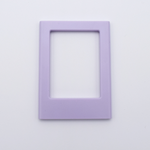 DIY Decoden customizable lilac Polaroid loader frames with frosting-inspired glue, decorative sprinkles, charms, and magnets for personalizing your photos.