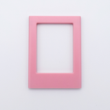 DIY Decoden customizable blush pink Polaroid loader frames with frosting-inspired glue, decorative sprinkles, charms, and magnets for personalizing your photos.