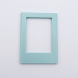 DIY Decoden customizable sea foam green Polaroid loader frames with frosting-inspired glue, decorative sprinkles, charms, and magnets for personalizing your photos.