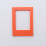 DIY Decoden customizable orange   Polaroid loader frames with frosting-inspired glue, decorative sprinkles, charms, and magnets for personalizing your photos.