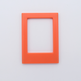 DIY Decoden customizable orange   Polaroid loader frames with frosting-inspired glue, decorative sprinkles, charms, and magnets for personalizing your photos.