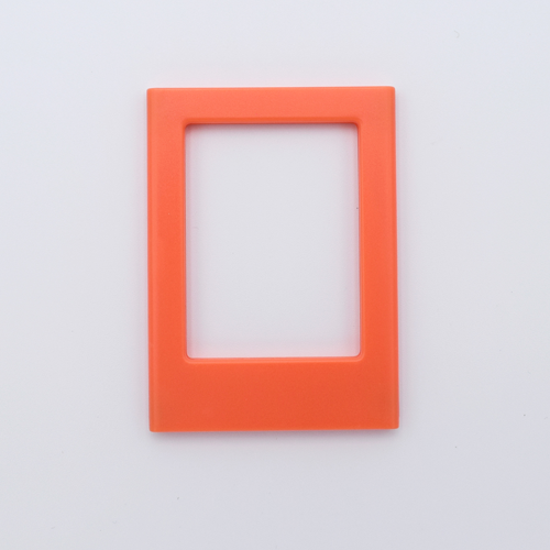 DIY Decoden customizable orange   Polaroid loader frames with frosting-inspired glue, decorative sprinkles, charms, and magnets for personalizing your photos.