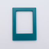 DIY Decoden customizable teal  Polaroid loader frames with frosting-inspired glue, decorative sprinkles, charms, and magnets for personalizing your photos.