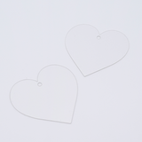 DIY Decoden customizable heart-shaped acrylic ornament with frosting-inspired glue, decorative sprinkles, charms, and a color choice of string, perfect for hanging on bags or keychains.