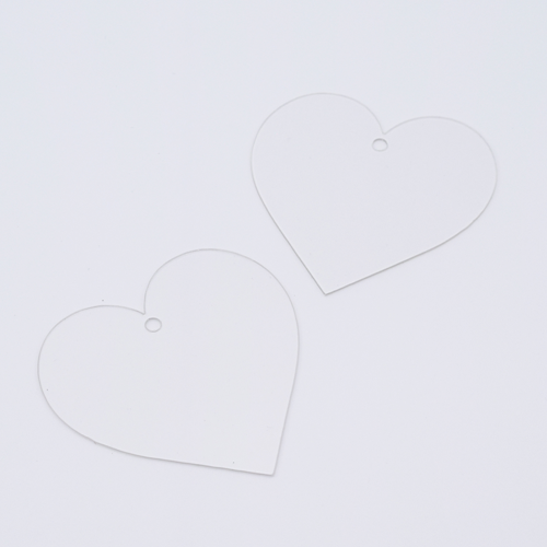 DIY Decoden customizable heart-shaped acrylic ornament with frosting-inspired glue, decorative sprinkles, charms, and a color choice of string, perfect for hanging on bags or keychains.